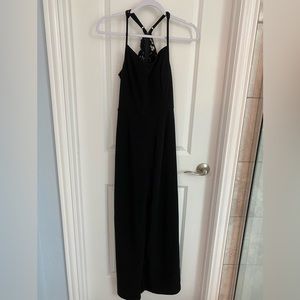 Black sleeveless Francesca’s jumpsuit. Wide leg. V-neck. Back detail. Size S.